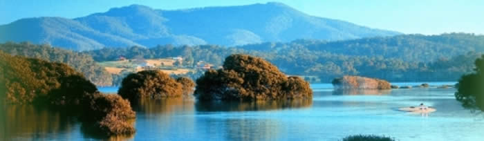 Narooma activities include kayaking and canoeing Wagonga Inlet